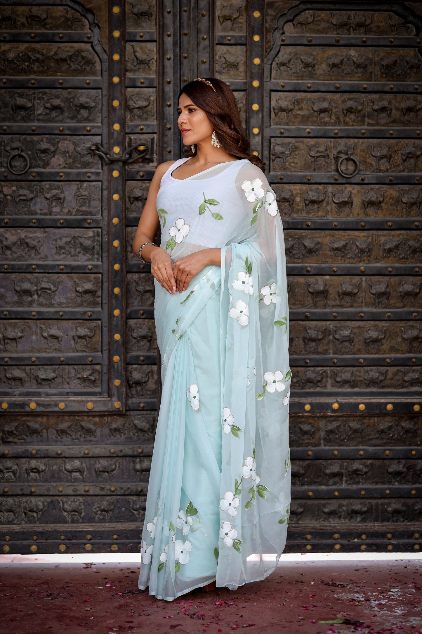 Elegant light blue designer saree with floral embroidery, perfect for special occasions