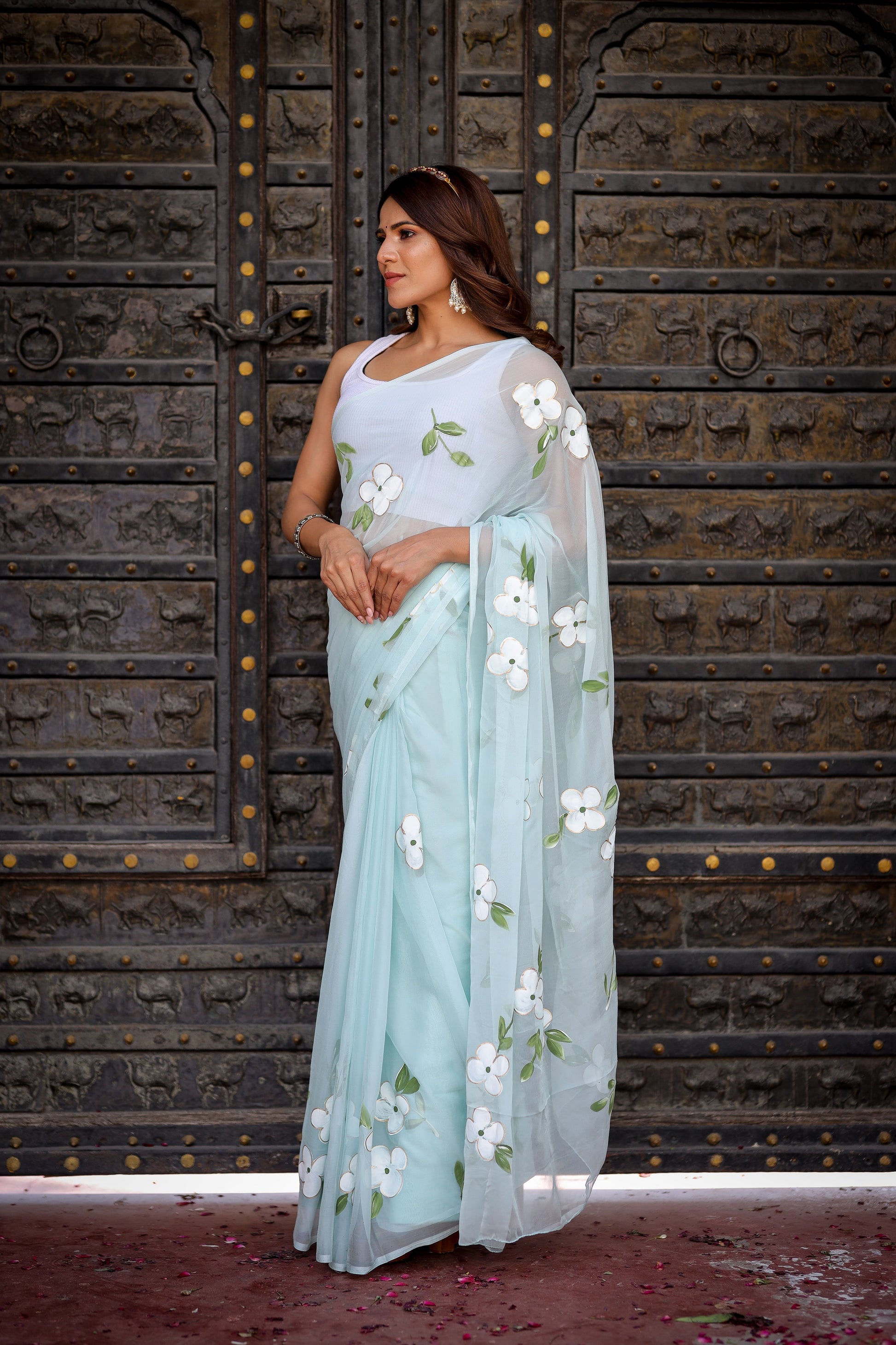 Elegant light blue designer saree with floral embroidery, perfect for special occasions