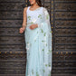 Light blue designer saree with floral embroidery, perfect for elegant occasions and celebrations