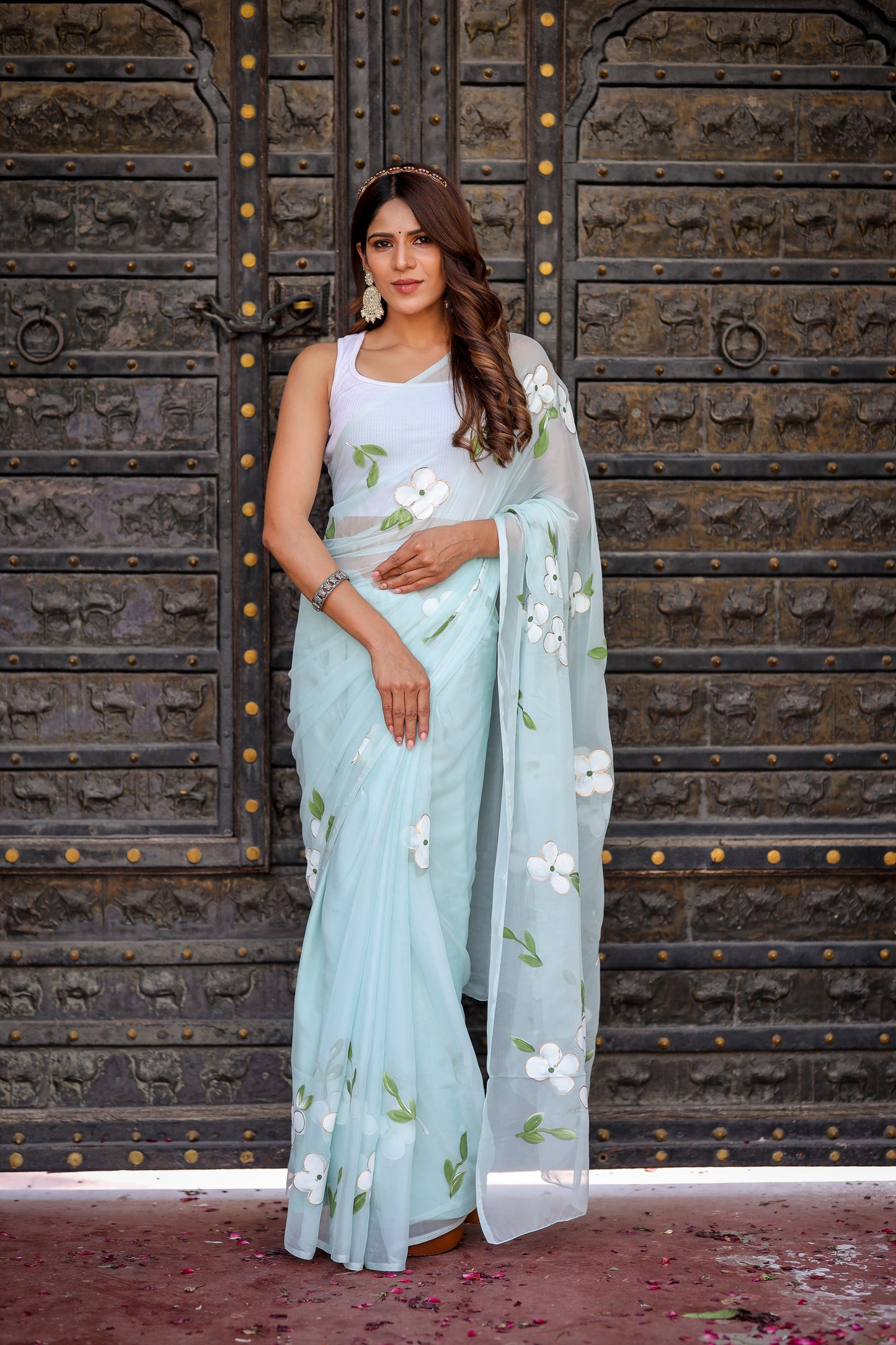 Elegant light blue designer saree with floral embroidery, perfect for special occasions and festive events