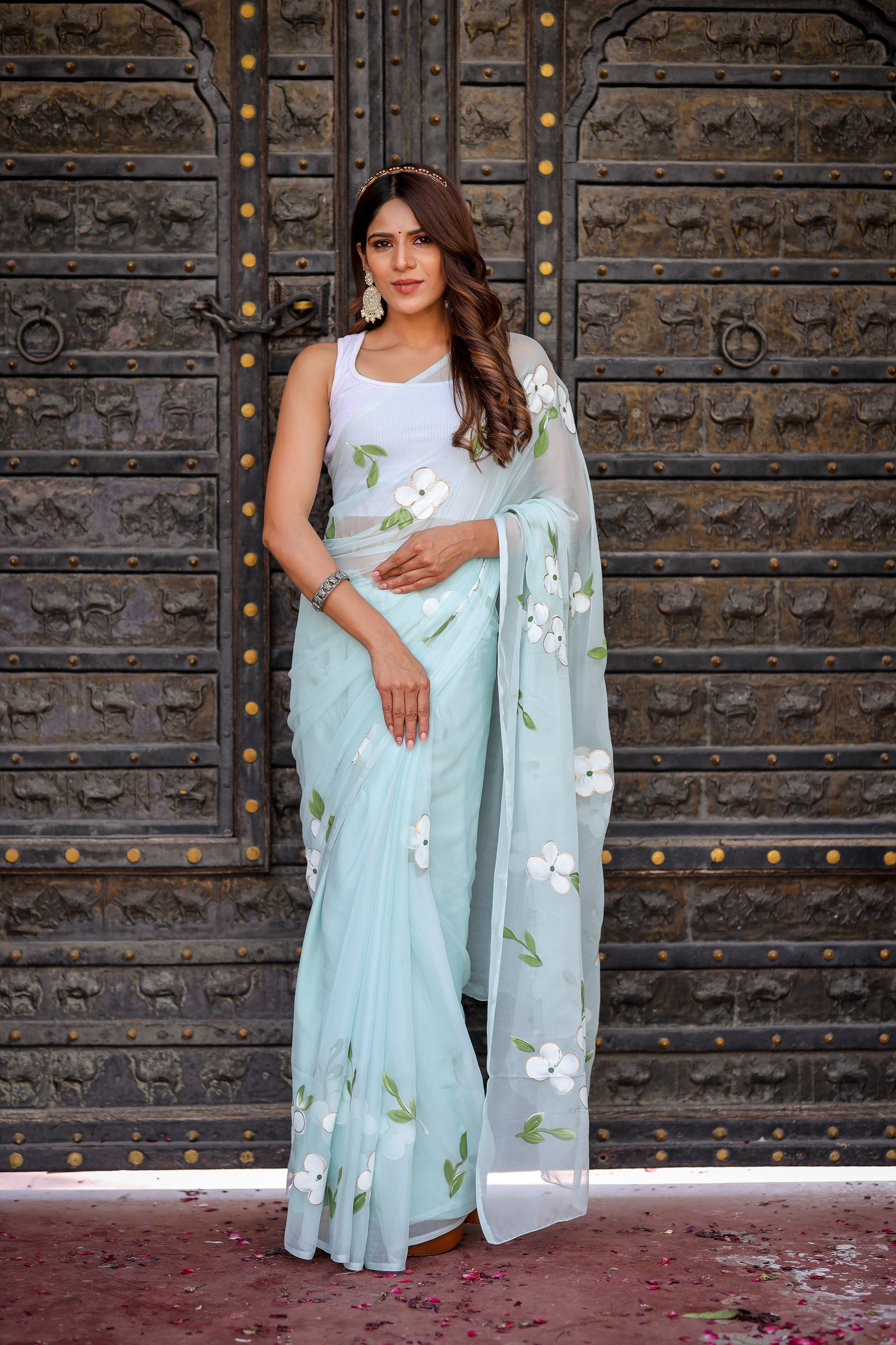 Elegant light blue designer saree with floral embroidery, perfect for special occasions and festive events