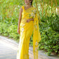 Elegant yellow designer saree with floral art, perfect for festive occasions and celebrations