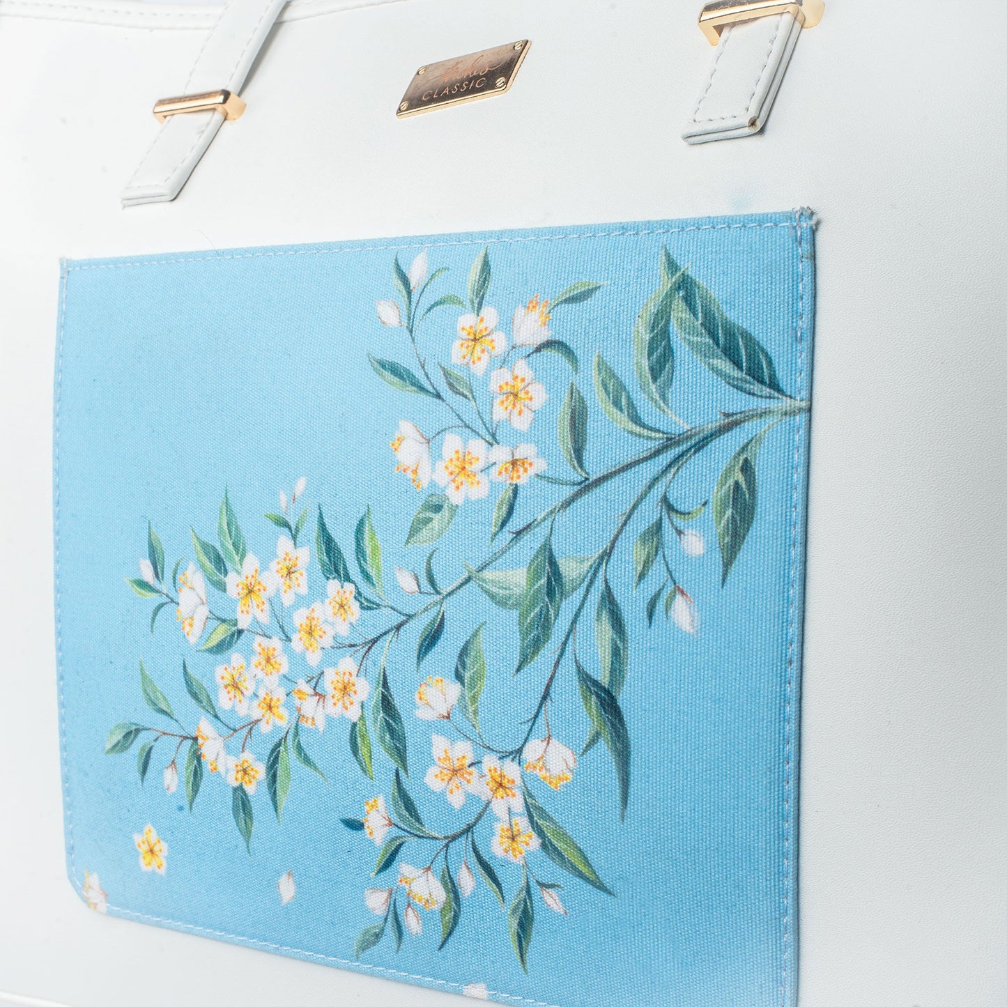 Stylera large designer tote bag featuring a floral print on a blue background