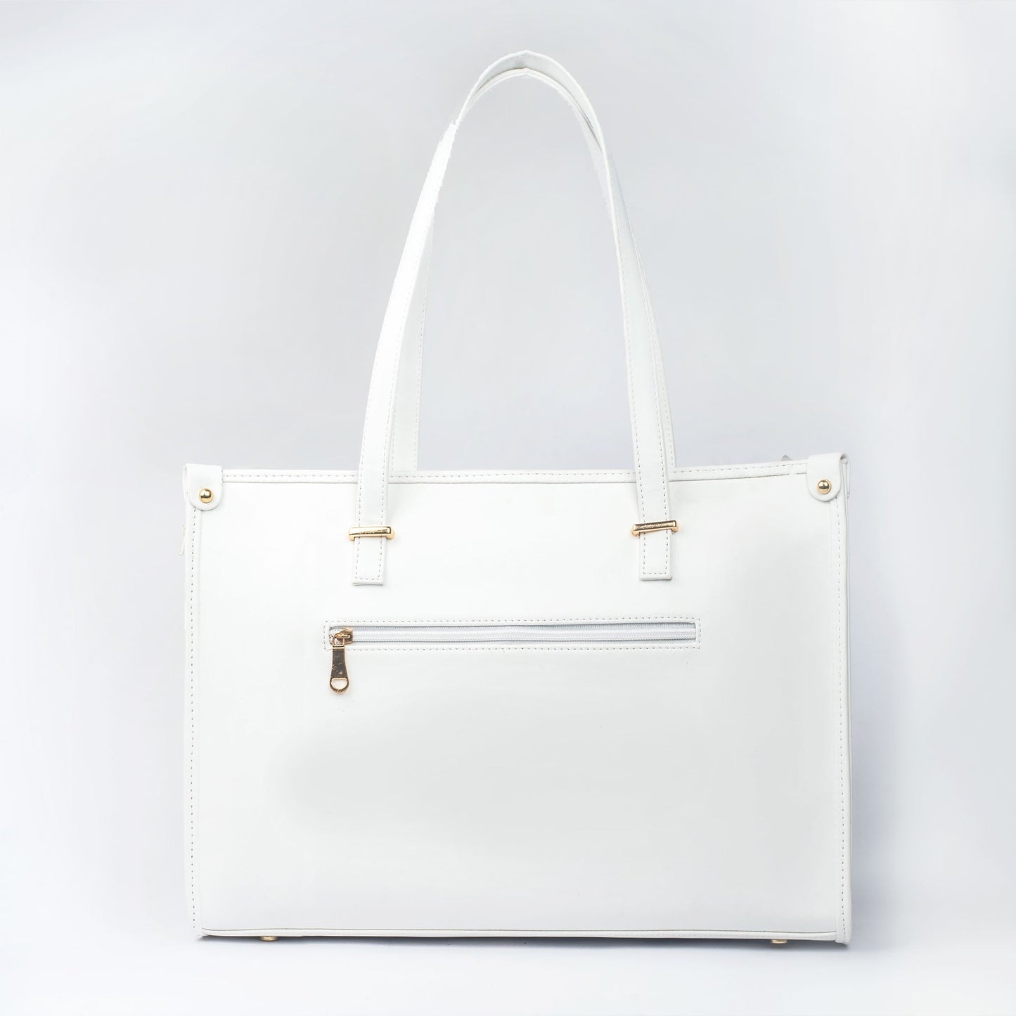 Large designer tote bag in white with gold accents and a zippered pocket for added convenience