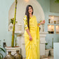 Elegant designer yellow saree hand painted with floral designs, perfect for festive occasions