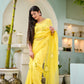 Elegant designer yellow saree hand painted with floral patterns for a stylish ethnic look