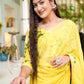 Model wearing a designer yellow saree hand painted with floral patterns for a vibrant look
