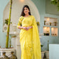 Elegant designer yellow saree hand painted with floral designs, worn by a model in a beautiful setting