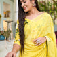 Elegant designer yellow saree hand painted with floral designs, perfect for special occasions