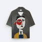 Stylera artistic printed resort shirt in gray featuring a large abstract face print with red eye accent