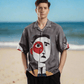 Stylera mens artistic printed resort shirt gray camp collar with large abstract face print on beach