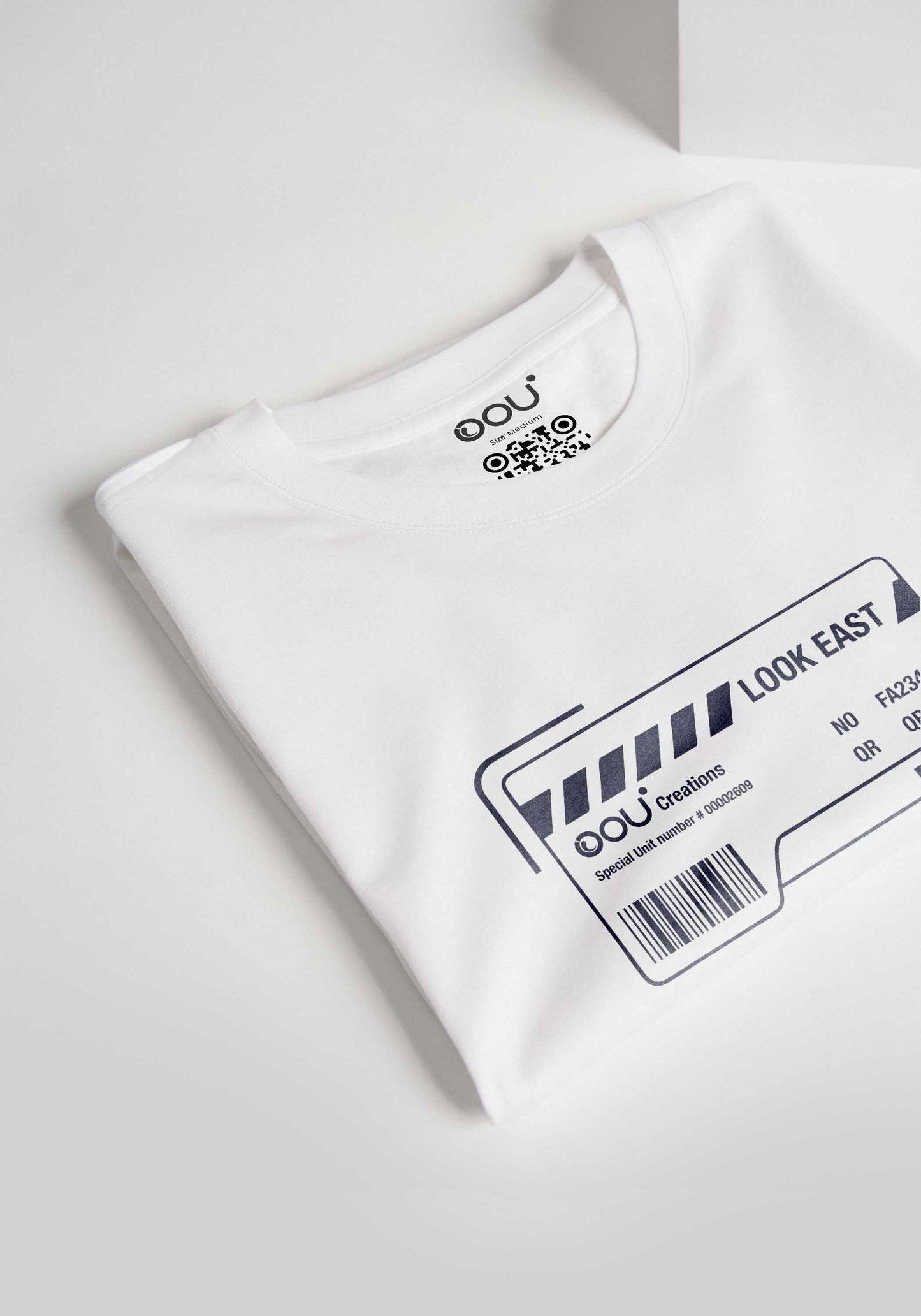 Folded white regular fit t-shirt from Stylera with printed graphic design on front