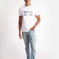 Man wearing Stylera white regular fit t-shirt with graphic design and light blue jeans