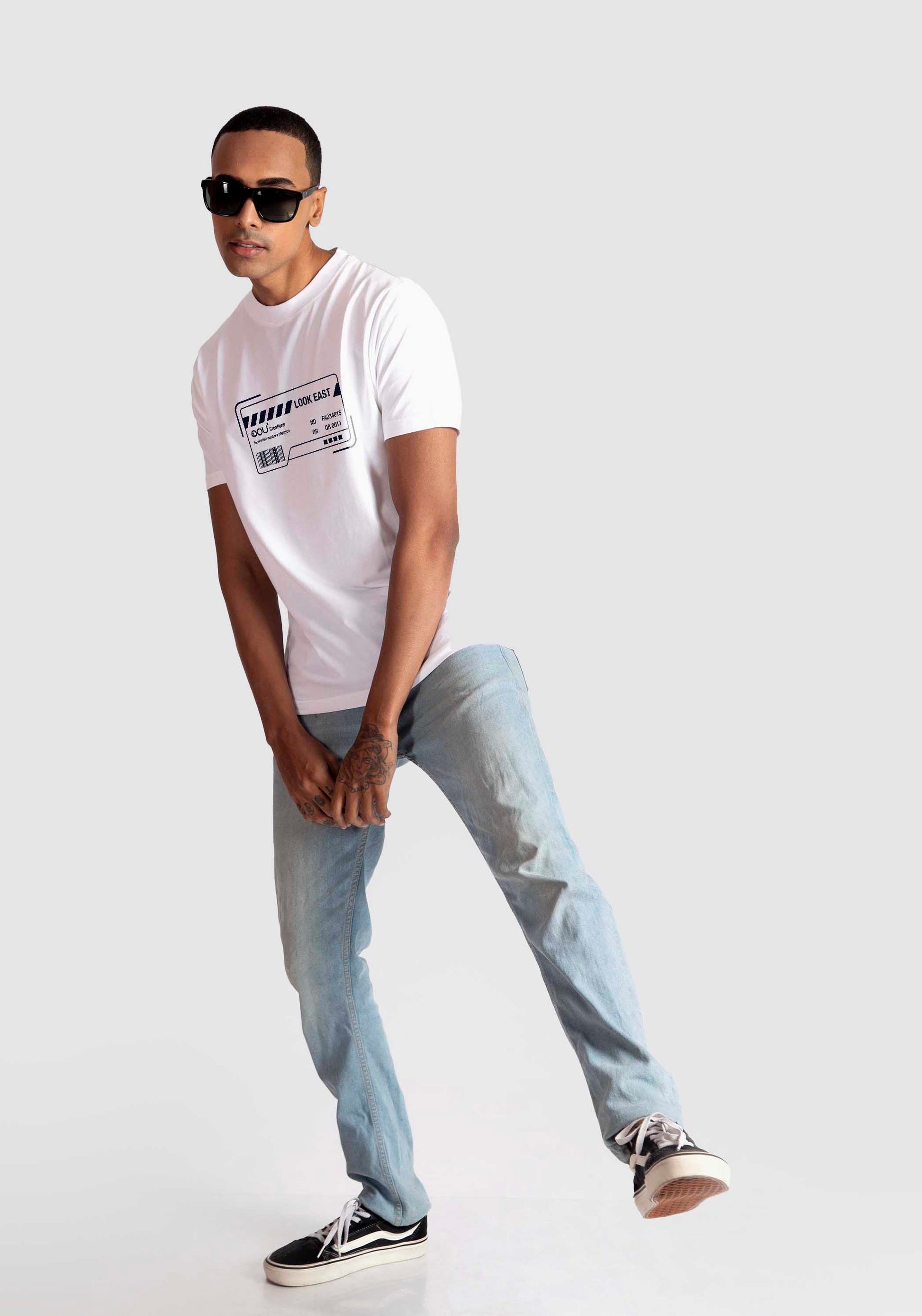 Stylera white regular fit t-shirt with graphic print worn by male model with sunglasses and light blue jeans
