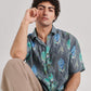 Stylera drop shoulder shirt for men in gray with tropical leaf and animal print design