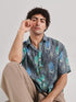 Stylera drop shoulder shirt for men in gray with tropical leaf and animal print design