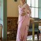 Model wearing an elegant party wear chiffon saree in light pink with floral embroidery accents