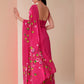 Elegant pink saree for parties featuring floral embroidery and a stylish drape for a chic look