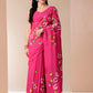 Elegant pink saree for parties featuring floral embroidery and a graceful drape