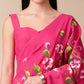 Elegant pink saree for parties featuring vibrant floral prints and stylish design