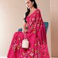 Elegant pink saree for parties with floral designs, paired with a stylish bag and earrings