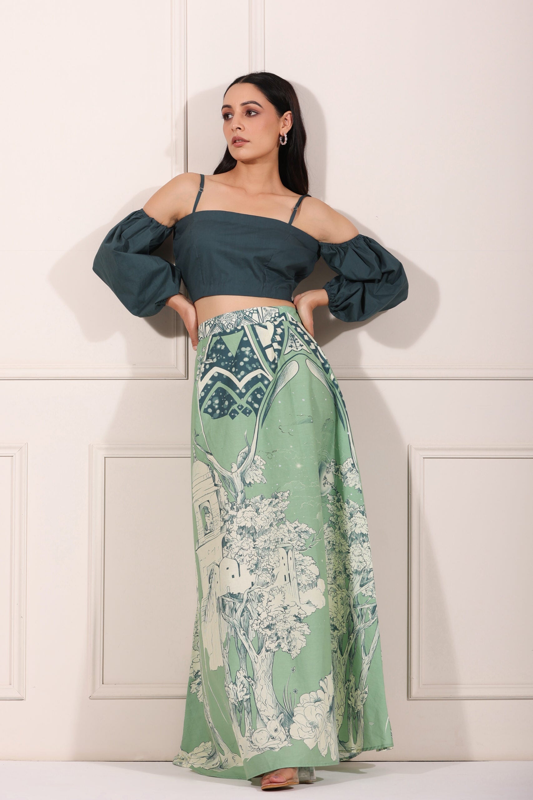 Elegant ethnic crop top and skirt set featuring a dark green crop top and patterned flowy skirt