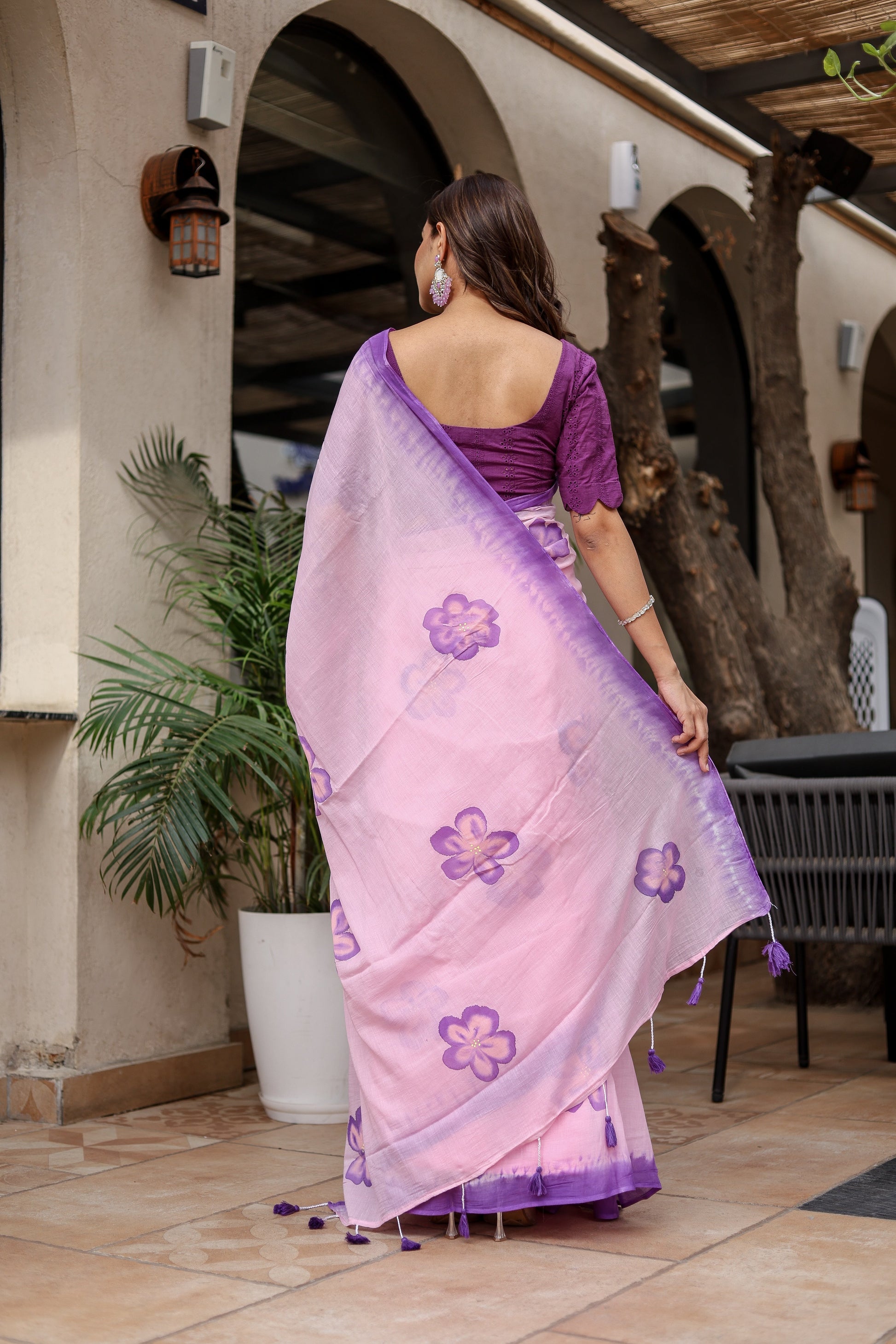 Elegant Stylera exclusive designer saree for parties in pink with purple floral design and trendy draping