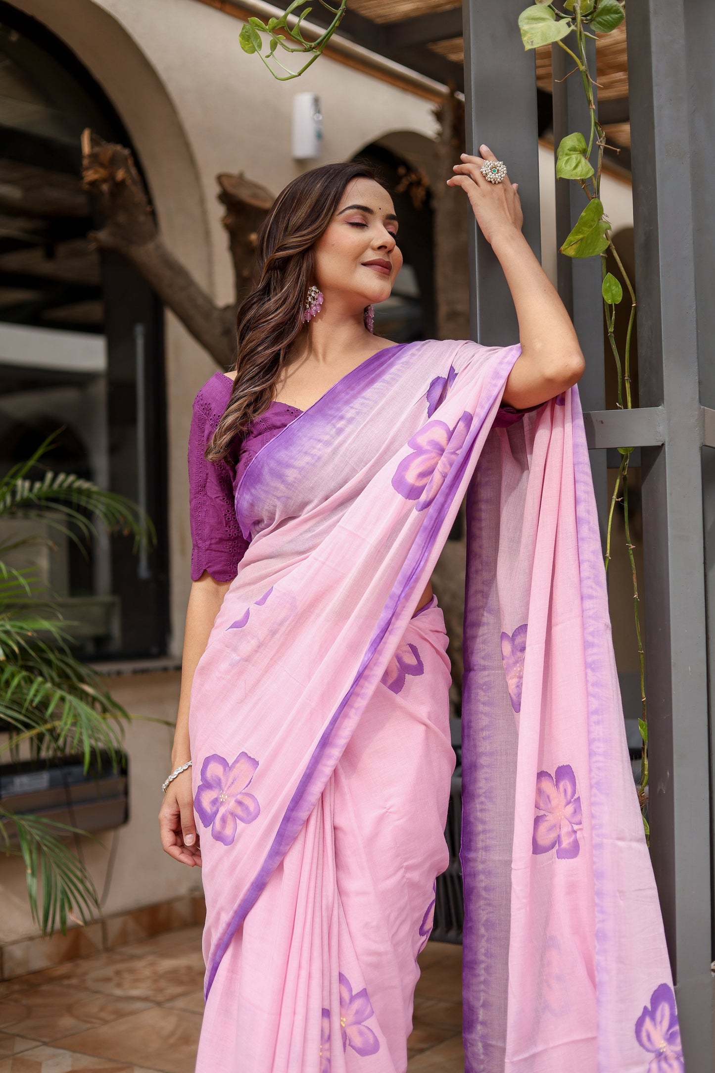 Elegant pink exclusive designer saree for parties with floral patterns and a stylish drape