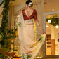 Elegant woman wearing an exclusive handmade Indian saree with intricate floral design, showcasing traditional beauty