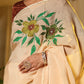 Exclusive handmade Indian saree in soft beige with vibrant floral embroidery for elegant occasions