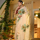 Elegant woman in an exclusive handmade Indian saree with vibrant floral designs, perfect for festive occasions