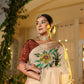 Elegant model wearing an exclusive handmade Indian saree with floral embroidery and traditional accessories