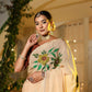 Elegant woman wearing an exclusive handmade Indian saree with floral embroidery and traditional jewelry