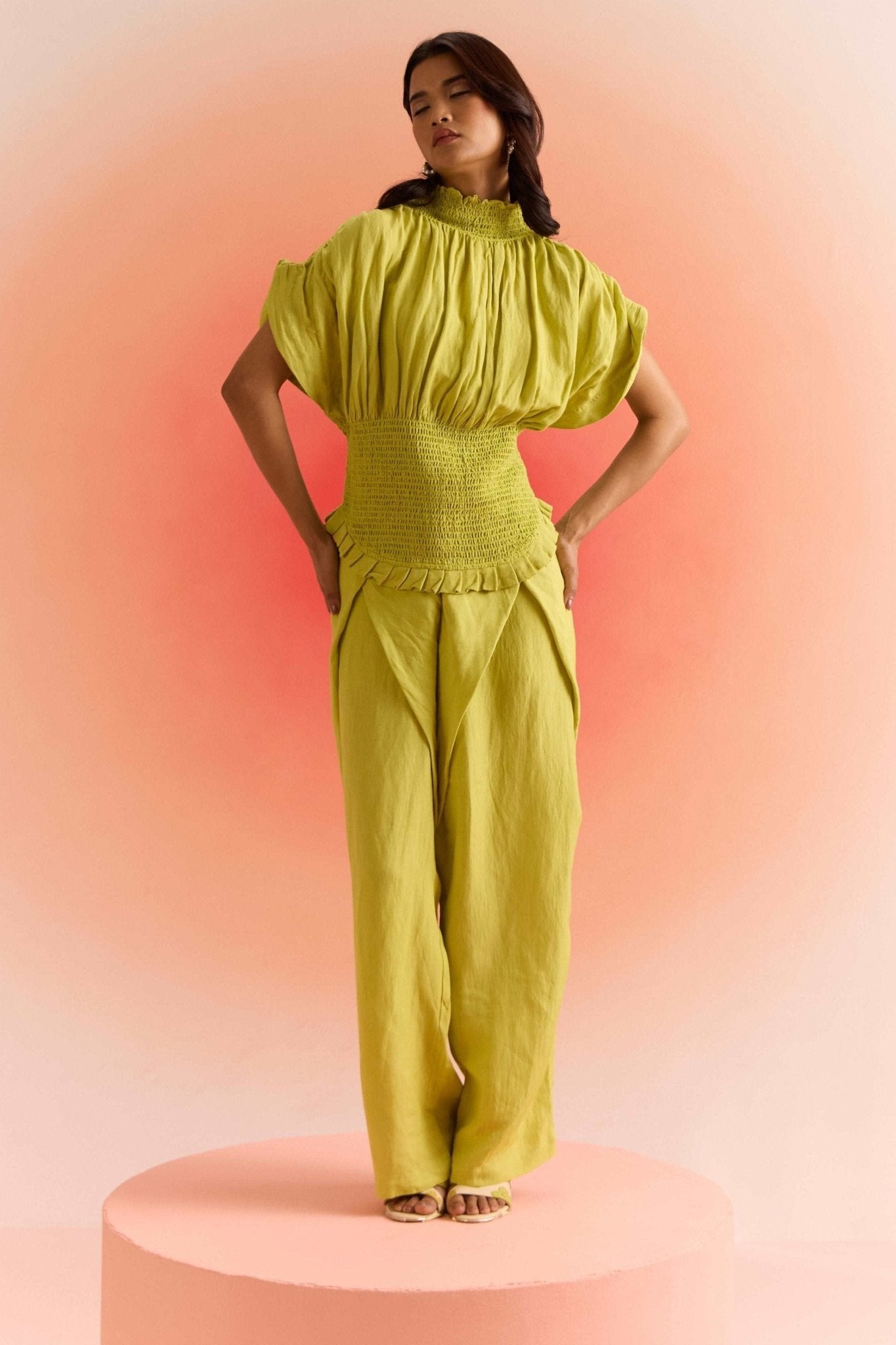 Stylera green smocked top with high neck and loose sleeves paired with matching wide-leg pants
