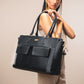 Stylish oversized tote bag by Stylera featuring pockets, perfect as a fashionable large tote for laptops