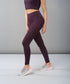 Stylera fashionable leggings for women in purple leopard print, paired with athletic shoes