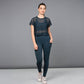 Model wearing fashionable workout leggings teal with a stylish mesh top for an inspired fitness look