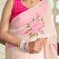 Elegant floral organza saree for women in soft pink with floral embroidery and matching accessories