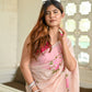 Elegant floral organza saree for women featuring vibrant pink floral patterns and a soft transparent texture