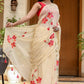 Elegant floral print cream saree with red flowers and delicate tassels for festive occasions
