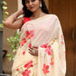 Floral print cream saree featuring colorful floral designs, perfect for festive occasions
