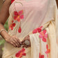 Stylera floral print cream saree with vibrant pink floral embroidery and elegant drape