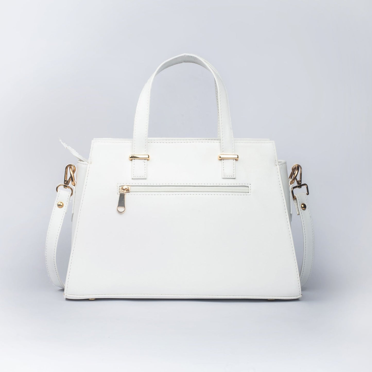 Stylish white floral print designer handbag with adjustable strap and gold accents