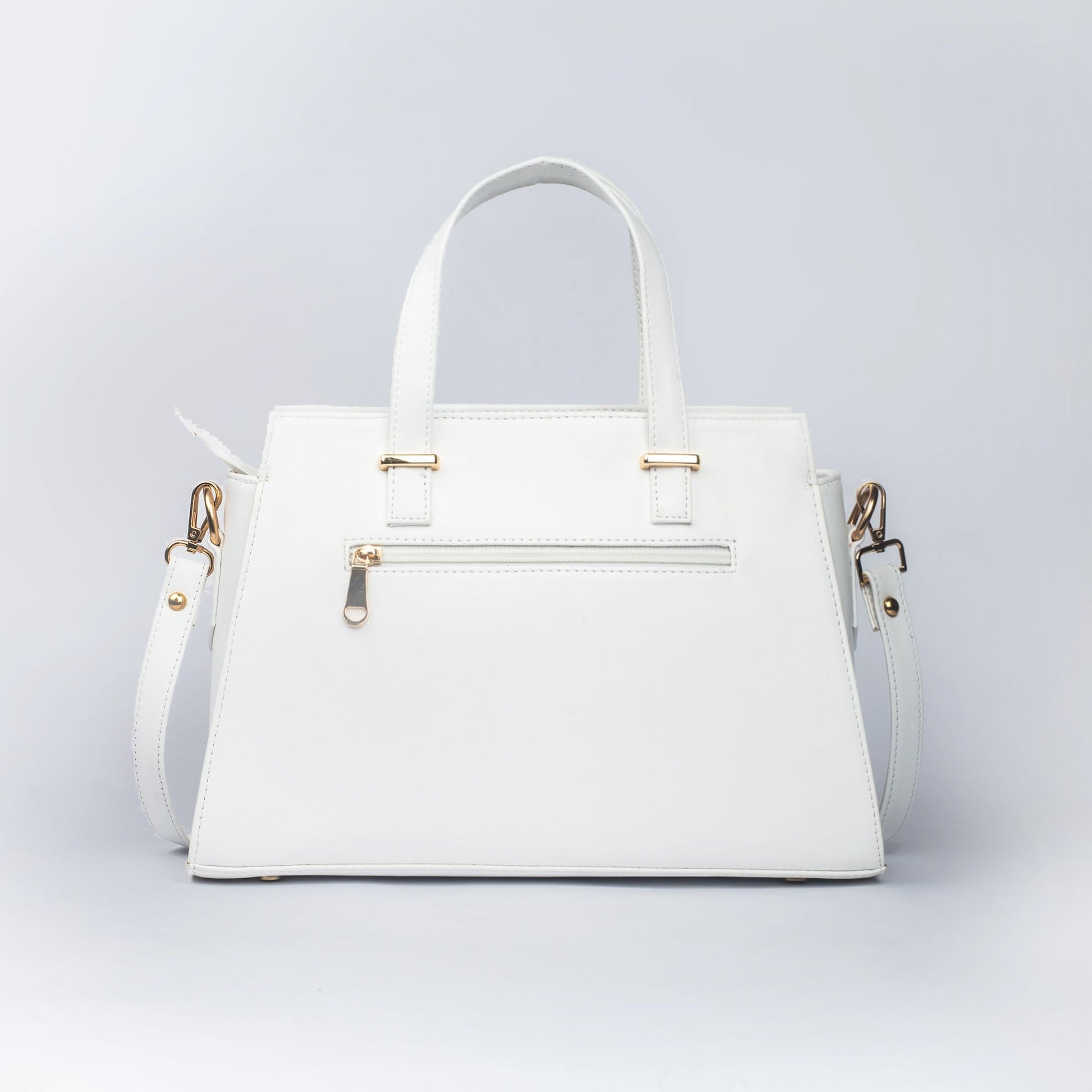 Stylish white floral print designer handbag with adjustable strap and gold accents