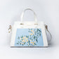 Stylera floral print designer handbag with elegant floral design on a light blue background