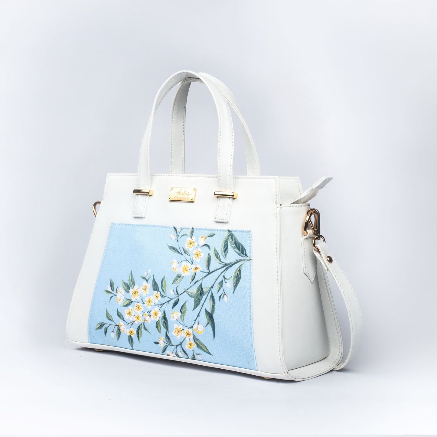 Stylera floral print designer handbag in soft blue with elegant floral design