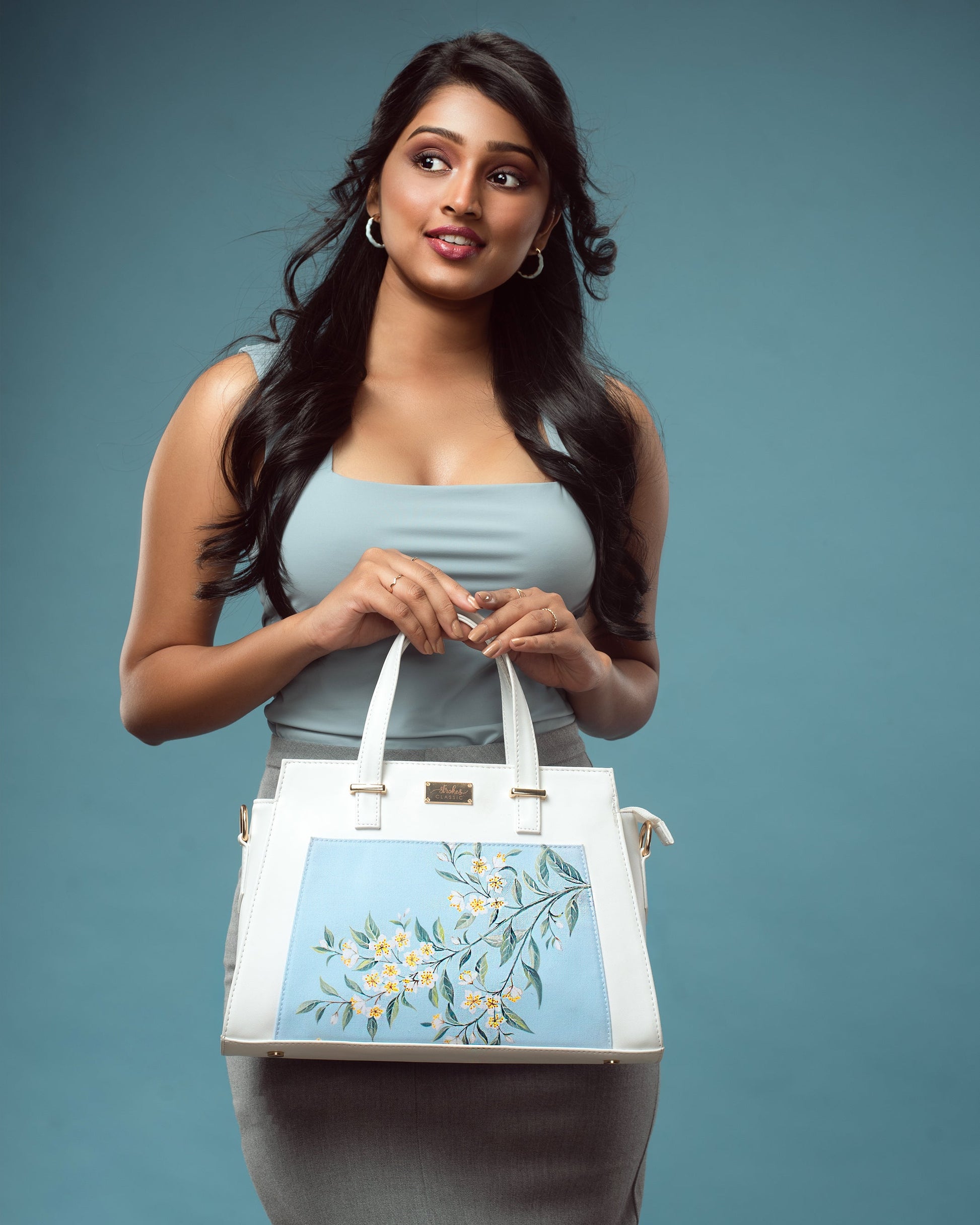 Elegant floral print designer handbag by Stylera with beautiful blue floral detailing