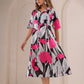Stylera floral print midi dress featuring bold pink flowers and a flowing design for a stylish look
