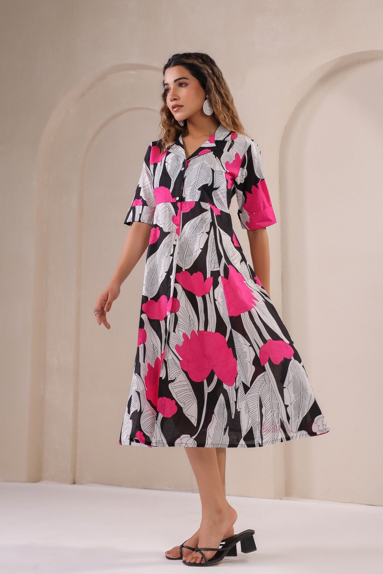 Stylera floral print midi dress featuring bold pink flowers and a flowing design for a stylish look