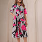 Floral print midi dress by Stylera with bold pink and black design, perfect for casual outings.